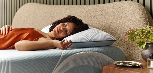 A woman sleeping on Adapt Pro Pillow