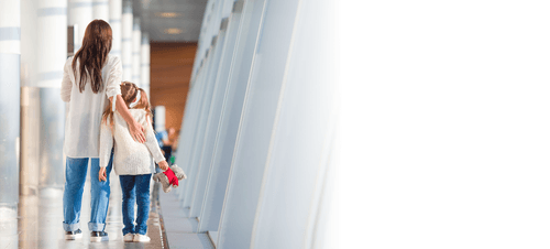 Woman and Child walking down Ronald McDonald House corridor