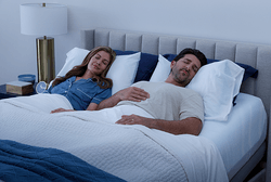 Couple sleeping on a dressed ActiveBreeze mattress